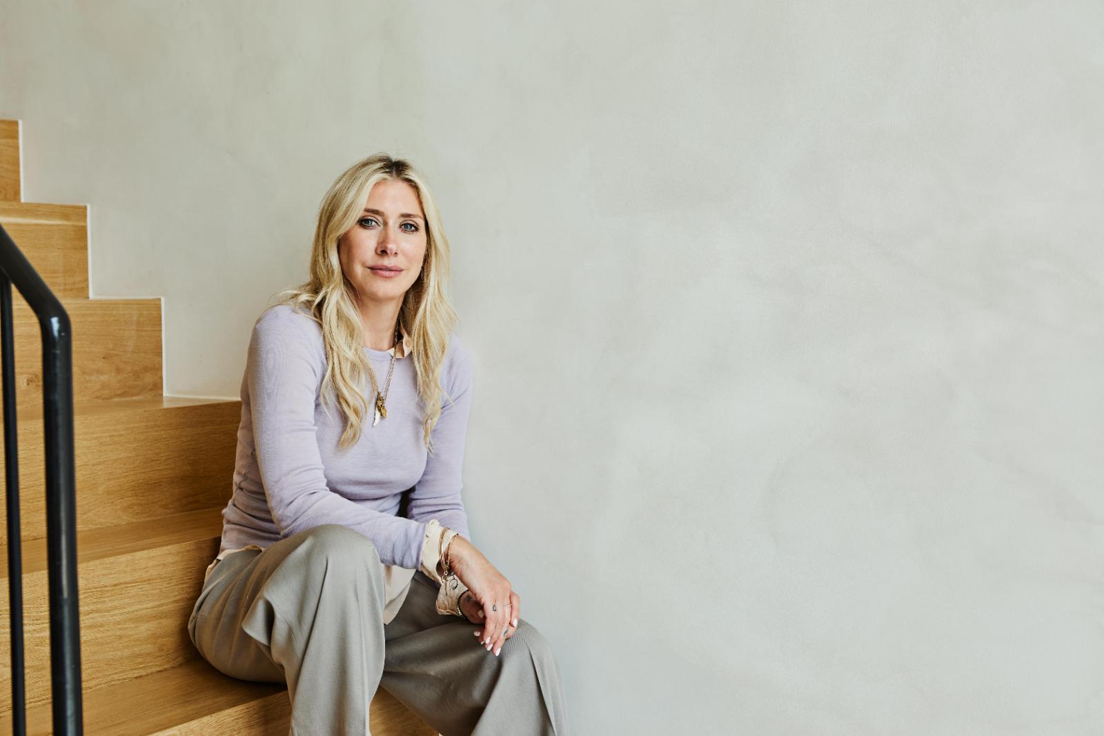 Emmy Brunner sitting on wooden stairs